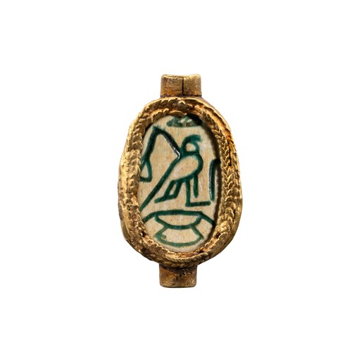 A Hyksos Scarab with gold mounting.